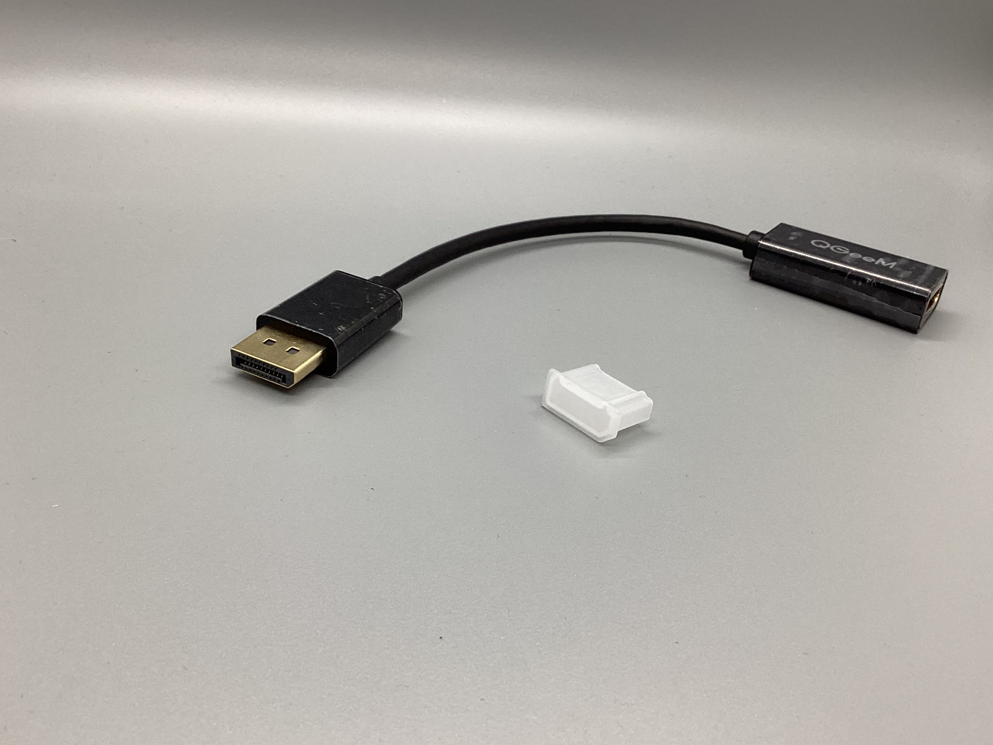 a black and white usb cable connected to a white device