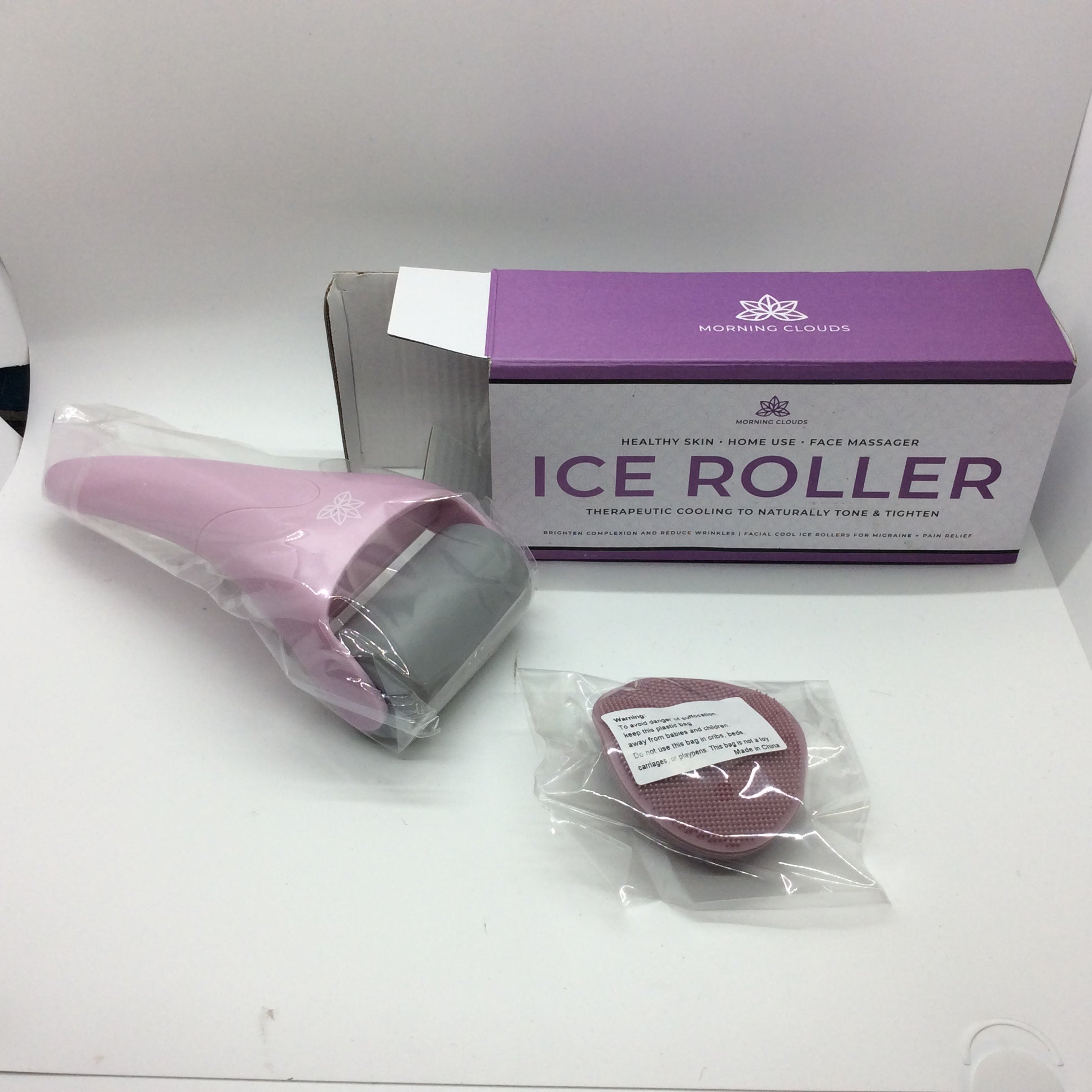 a hair dryer sitting next to a box of ice rollers